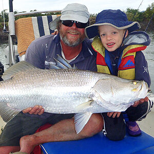 Man with son Barramundi fishing