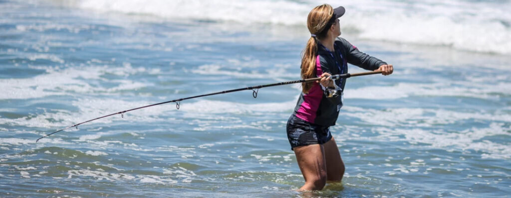 Townsville woman Fishing Strand Beach big rod